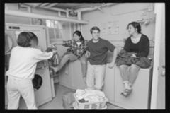 Thumbnail for Photographs of students in a laundry room, 1993 April - Image 1
