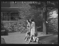 Thumbnail for Photographs of students outside on campus, 1974 May 15 - Image 1