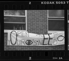 Thumbnail for Photographs of signs promoting need-blind admissions policies, October 1991 - Image 1