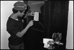 Thumbnail for Photographs of students in a lab and in the gym, 1972 October - Image 1